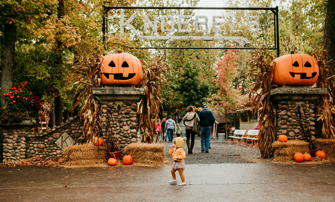little girl in front of the Knoebels Entrance Arch