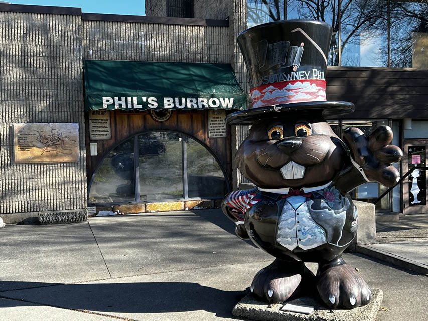 groundhog statue with cap on