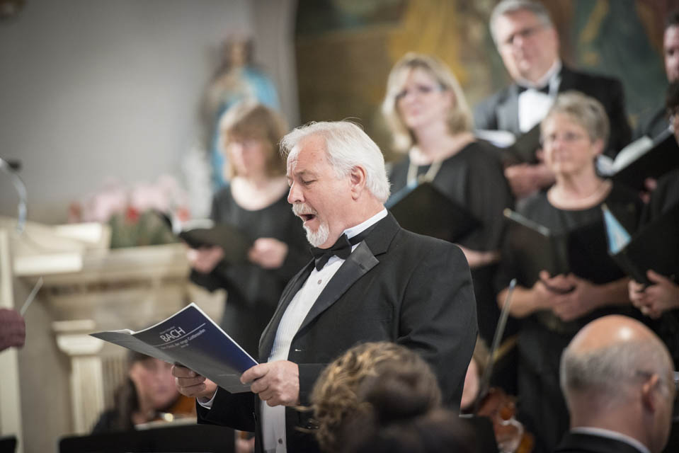 a person leading a choir