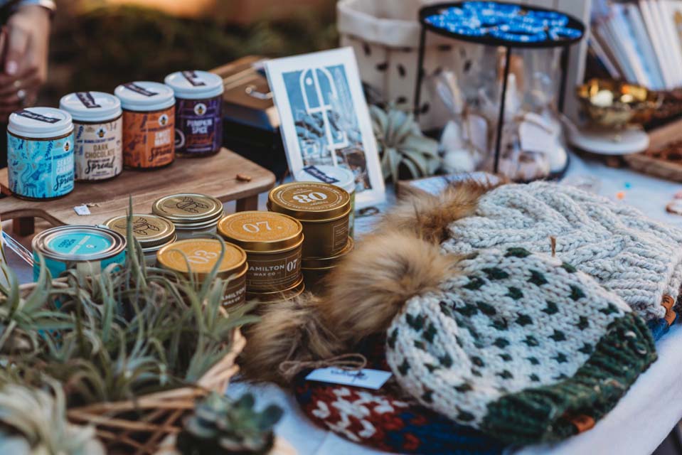 skull caps candles and decor items at winter market