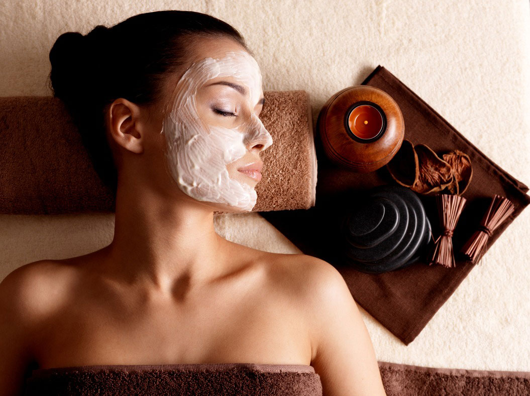A women relaxing with facial spa treatment