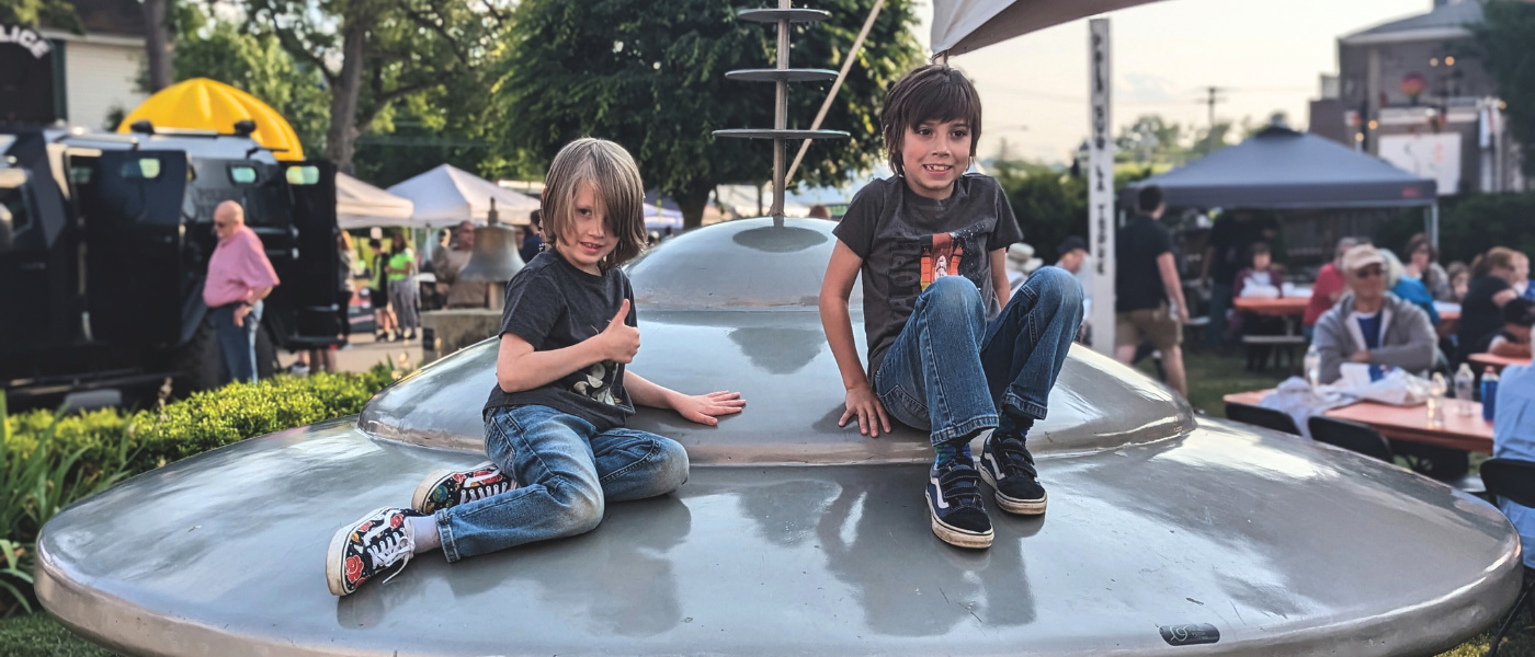 Kids sitting on top of a UFO