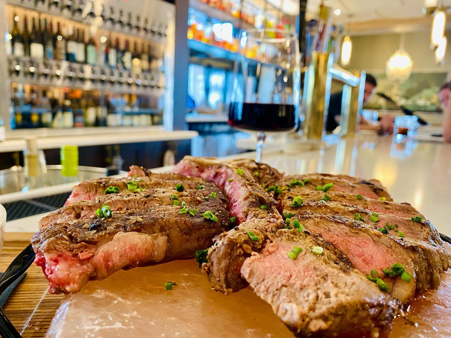 Medium rare Steak served with Wine