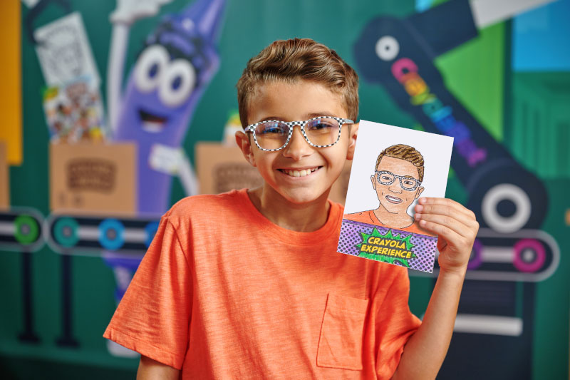 a kid holding a personal sketch