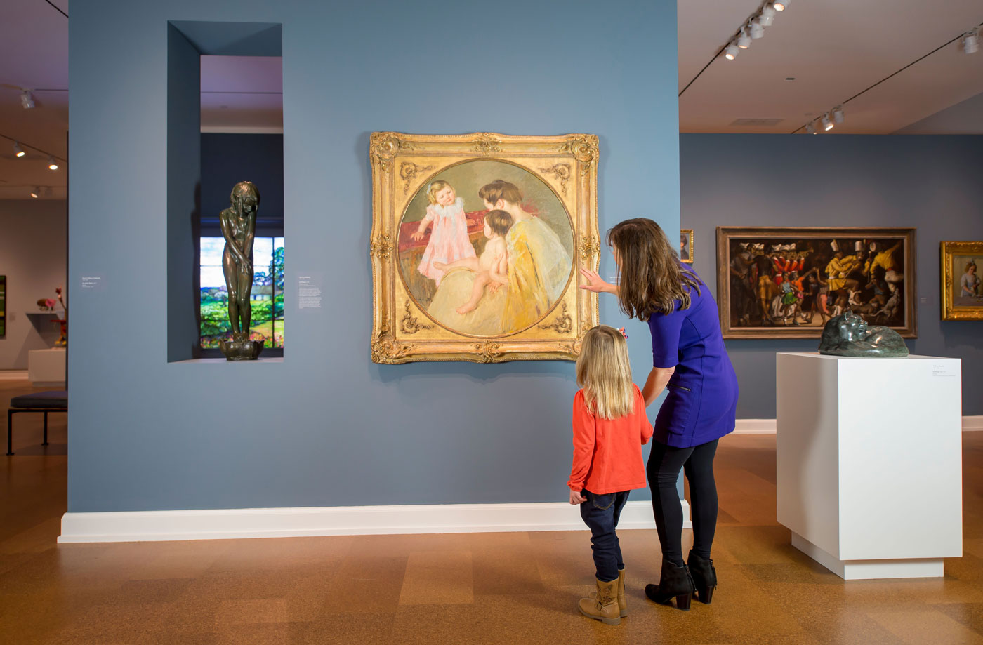mother daughter duo exploring museum art