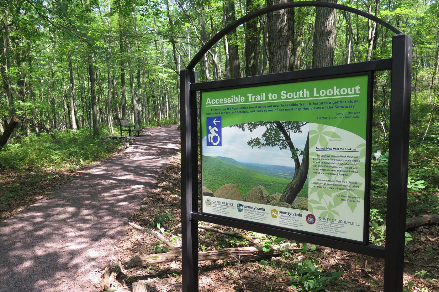 Accessible trail path with signage board