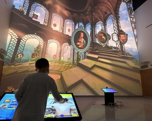 kid playing with interactive exhibit