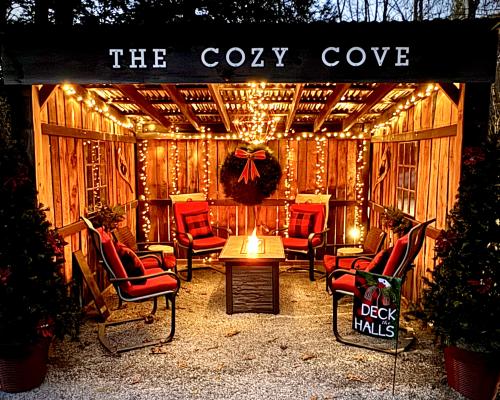 Outdoor firepit with the sign that reads Cozy Cove